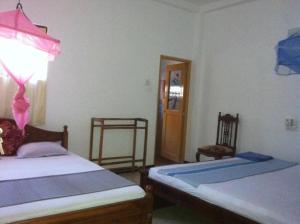 Katil atau katil-katil dalam bilik di Mila Rest Garden