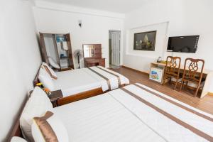 Postel nebo postele na pokoji v ubytování Caroline Resort