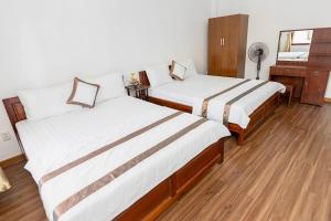 Postel nebo postele na pokoji v ubytování Caroline Resort