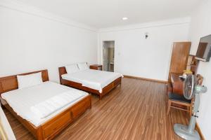 Postel nebo postele na pokoji v ubytování Caroline Resort
