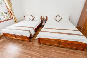 Postel nebo postele na pokoji v ubytování Caroline Resort