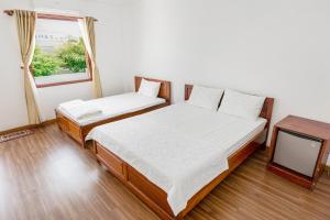Postel nebo postele na pokoji v ubytování Caroline Resort