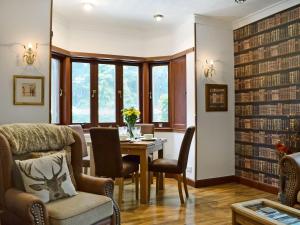 a dining room with a table and chairs at The Gate House in Markinch