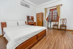 Postel nebo postele na pokoji v ubytování Caroline Resort