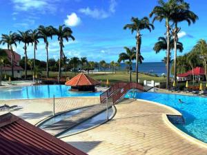 Piscina di Studio Tropical avec vue mer dans une résidence hôtelière o nelle vicinanze