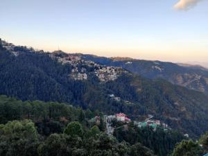 a town on top of a mountain at The Oaktree House in Shimla