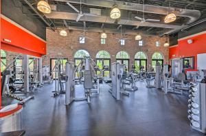 a gym with rows of treadmills and machines at Ole at Lely Resort Condo with Pool Access! in Lely Resort