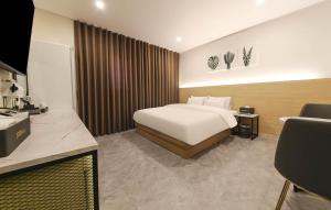 Postel nebo postele na pokoji v ubytování No25 Hotel Mokpo Sangdong