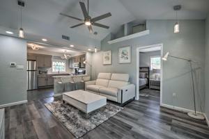 a living room with a couch and a ceiling fan at Apopka Getaway with Yard and Covered Patio in Apopka