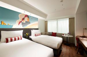 Citadines Harbour Front Yokohama客房内的一张或多张床位