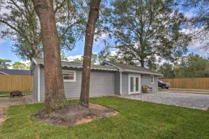 a house with trees in front of it at Apopka Getaway with Yard and Covered Patio in Apopka