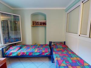 Łóżko lub łóżka w pokoju w obiekcie Charmant 3P au calme avec terrasse, proche de la mer à Menton - FR-1-196-317