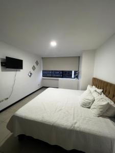 Cama o camas de una habitación en Cómoda suite en Puerto Santa Ana