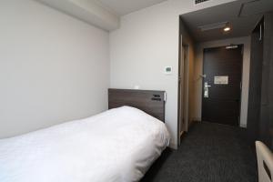 Postel nebo postele na pokoji v ubytování Silk Hotel