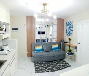 a living room with a couch in a kitchen at Ann's Condo "2bedroom" in Davao City