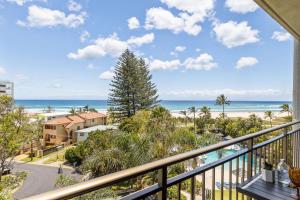 a balcony with a view of the beach and the ocean at Ocean Breeze at Palm Beach in Gold Coast