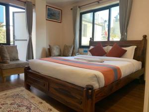 Letto o letti in una camera di Hotel Ramanam