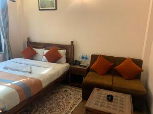 Letto o letti in una camera di Hotel Ramanam