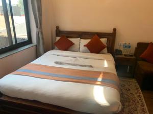 Letto o letti in una camera di Hotel Ramanam