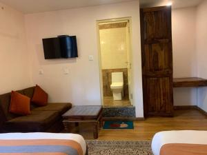 Letto o letti in una camera di Hotel Ramanam