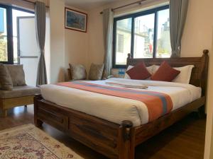 Letto o letti in una camera di Hotel Ramanam