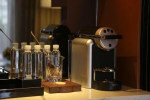 a table with bottles of liquids and a microscope at Bellagio by MGM Shanghai - on the bund in Shanghai