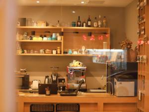 a kitchen with a counter with a coffee maker at Travel light Guilin in Guilin