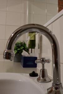 a sink with a faucet in a bathroom at Moama Motel in Moama