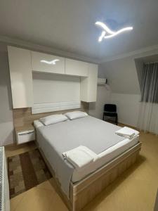 Ένα ή περισσότερα κρεβάτια σε δωμάτιο στο Hotel Chaika