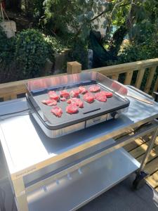 a grill with meat on top of a table at Saint tropez-Gassin Bungalow LUXE 6 personnes in Gassin