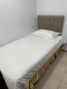 Postel nebo postele na pokoji v ubytování Hotel Uptown Semenyih