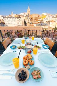 a table with plates of food on it with a view at The Haze Karaköy in Istanbul