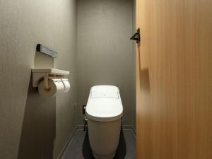 a bathroom with a white toilet in a stall at Asakusa View Hotel Annex Rokku in Tokyo
