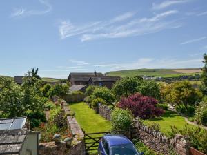 a car parked in the garden of a house at Hurst House in St Bees