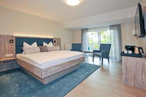 Postel nebo postele na pokoji v ubytování Hotel Grasberger Hof GmbH + 32 fotografií