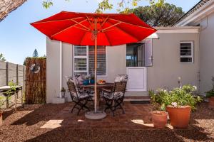 En terrasse eller udendørsområde på Tortelduif Cottage