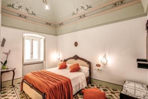 Llit o llits en una habitació de Palazzo Stunis - Dimora di Charme