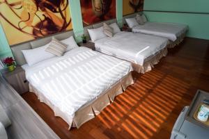A bed or beds in a room at Bei Pin B&B