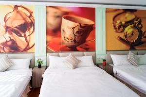 A bed or beds in a room at Bei Pin B&B
