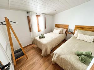 Postel nebo postele na pokoji v ubytování Casa La Buganvilla