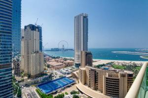 an aerial view of a city with tall buildings at The Smart Concierge - Royal Oceanic in Dubai