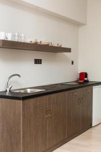 a kitchen with a sink and a counter top at Tsimiski #apartment (one bedroom) in Thessaloniki