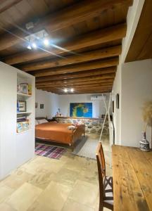 a bedroom with a bed and a wooden ceiling at The Family Nest - Traditional Serenity in Nicosia