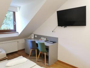TV a/nebo společenská místnost v ubytování Rooms Sincere 1830