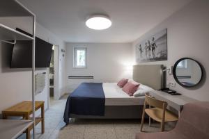 Postel nebo postele na pokoji v ubytování Holiday Park Vile - Terme Krka