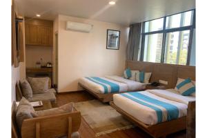 A bed or beds in a room at Hotel Tapas