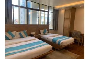 A bed or beds in a room at Hotel Tapas