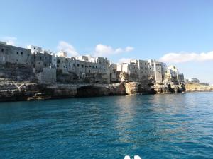 a view of a city from a boat in the water at MandorleOlio in Polignano a Mare