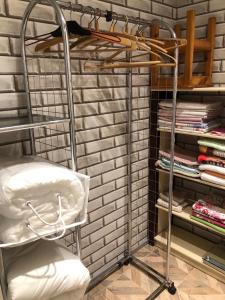 a room with a iron shelf and some books at Uku Villa in Pärnu