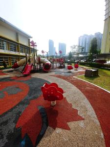 a playground with a red star painted on the ground at Homestay King Putrajaya sebelah Alamanda in Putrajaya